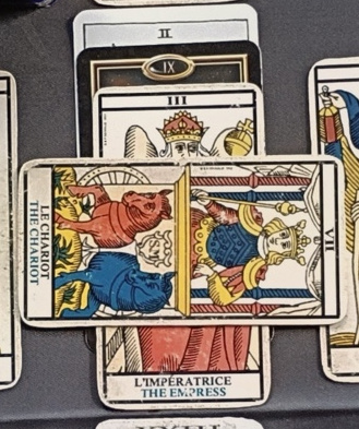 Central crossing: complete Empress/Chariot arrangement and two querent cards